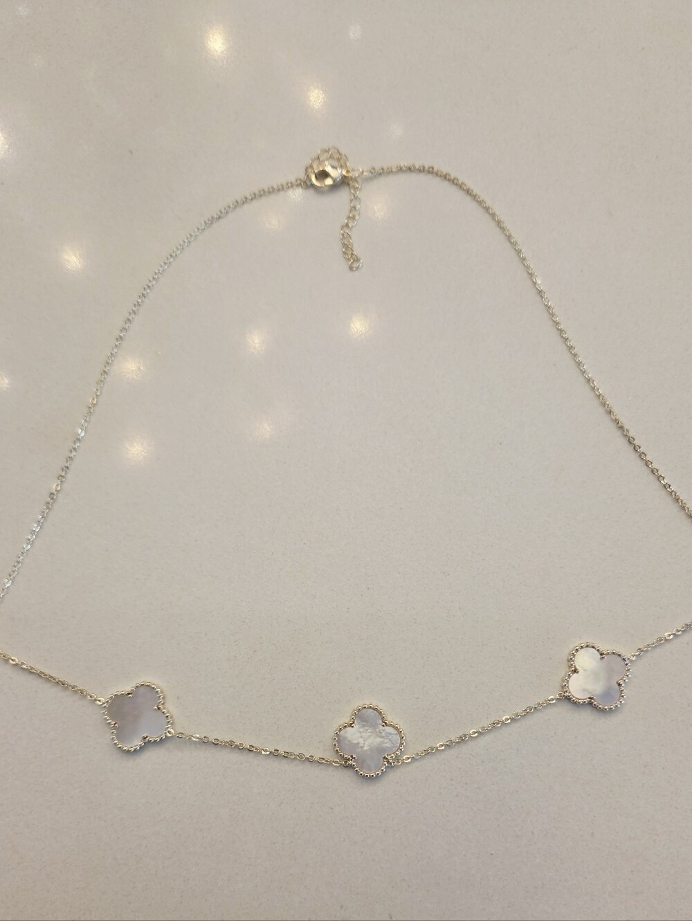 Delicate Gold Four-Leaf Clover Necklace with White Inlay